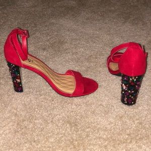 Red single-sole sandal with jeweled heel.